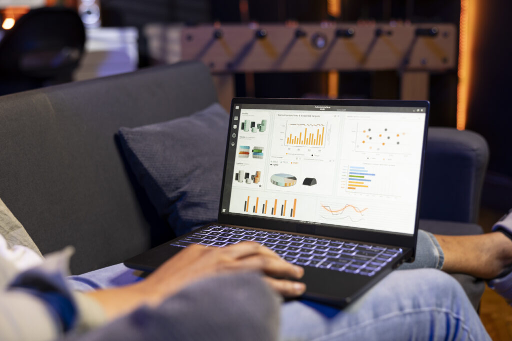 african american guy studying analytics and archived data for a project